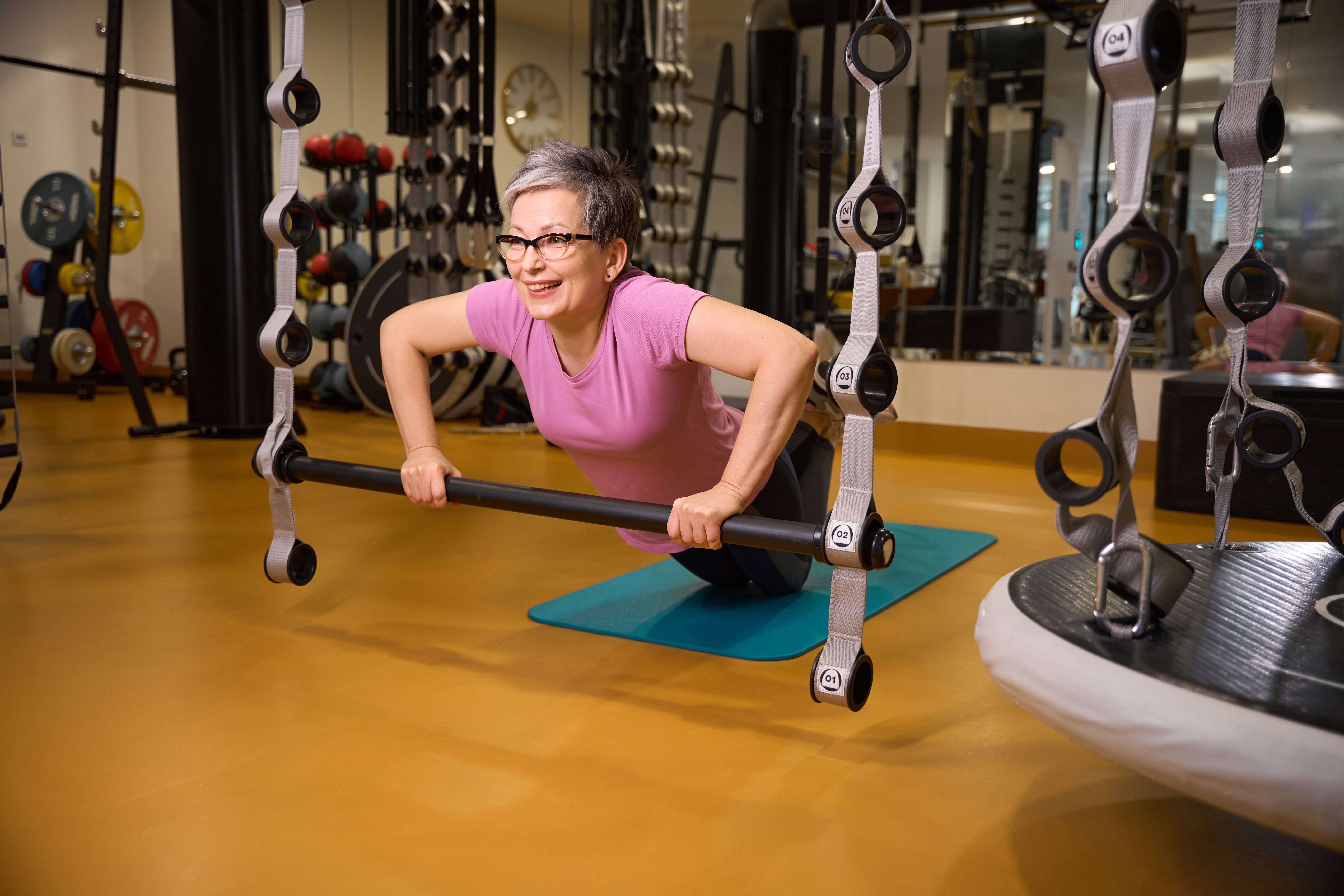 Active senior doing strength training with dumbbells